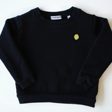 Vintage-inspired, garment-dyed black organic cotton children's sweatshirt with a vibrant lemon embroidery for a pop of color, made in the USA, part of Colorful Bunch's luxurious eco-friendly kids' clothing line.