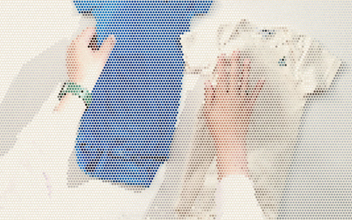 Blue and natural cotton baby bodysuits held against the studio wall; a bold Paper halftone photo treatment