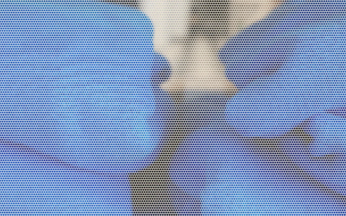 Blue cotton pullovers folded on a wooden shelf; a bold Paper halftone photo treatment