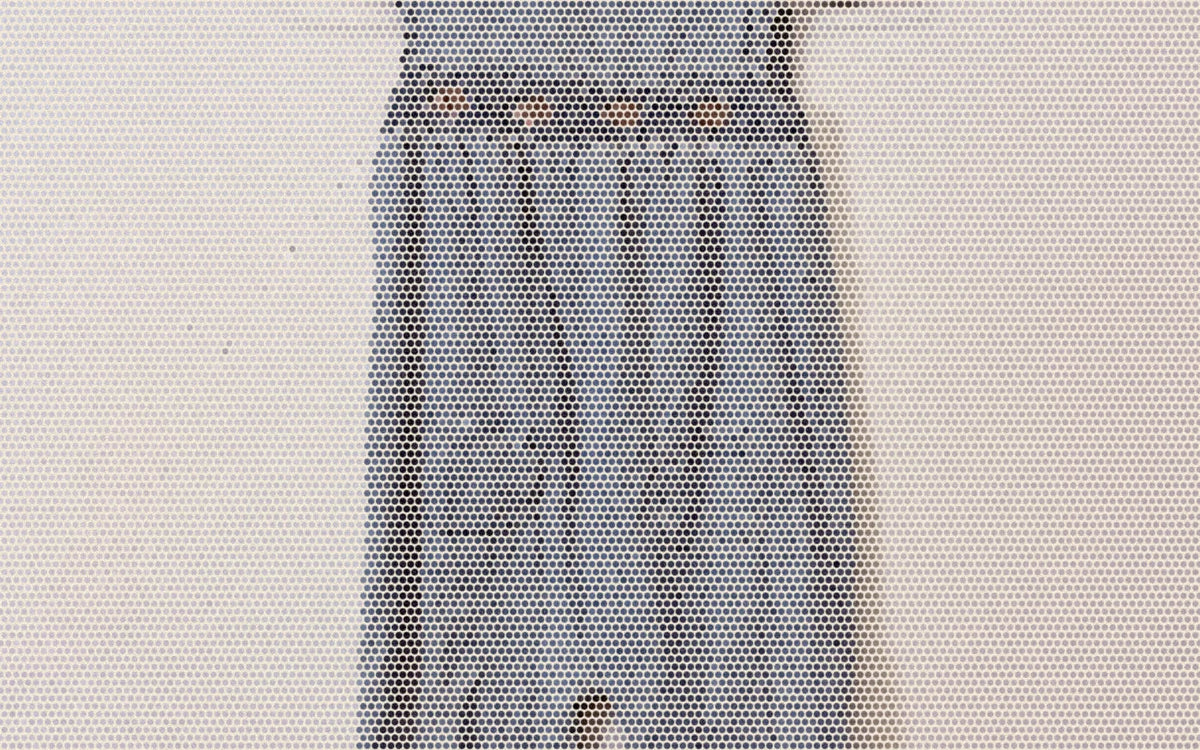 Halftone close-up of the gathered waist of a small garment hanging from clips.