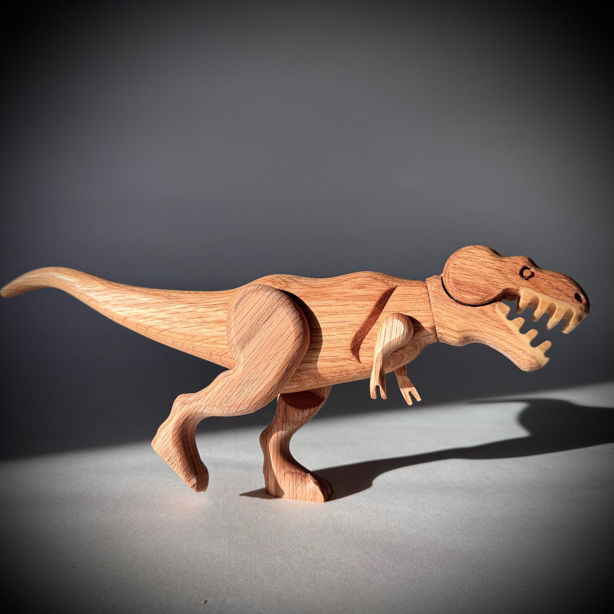 Tyrannosaurus wooden toy with magnetic head, jaw, arms, and legs