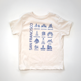 Undyed kids tee printed in blue with San Francisco landmarks, laid flat on a white background.